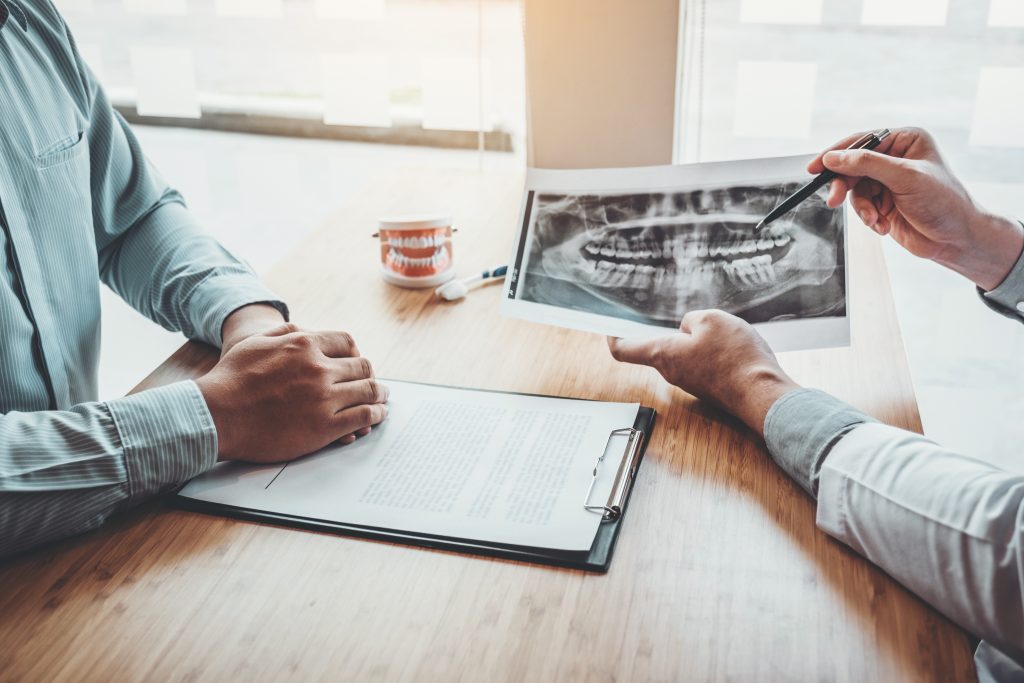 two people discussing an X-ray