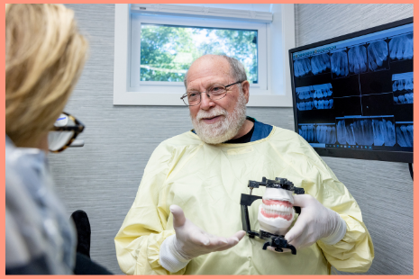 Dr White talking to a patient